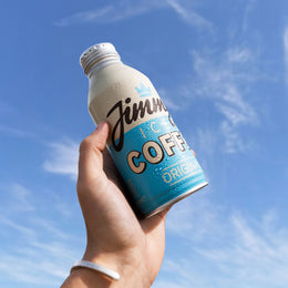 Holding a Jimmy's Iced Coffee 380ml Original